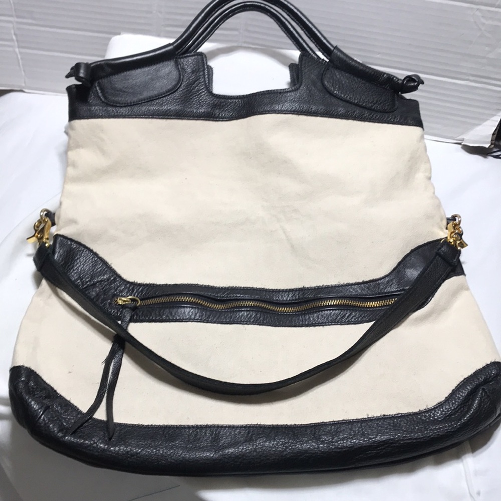 Anna Corina folded leather with canvas handbag with double straps. Like new!